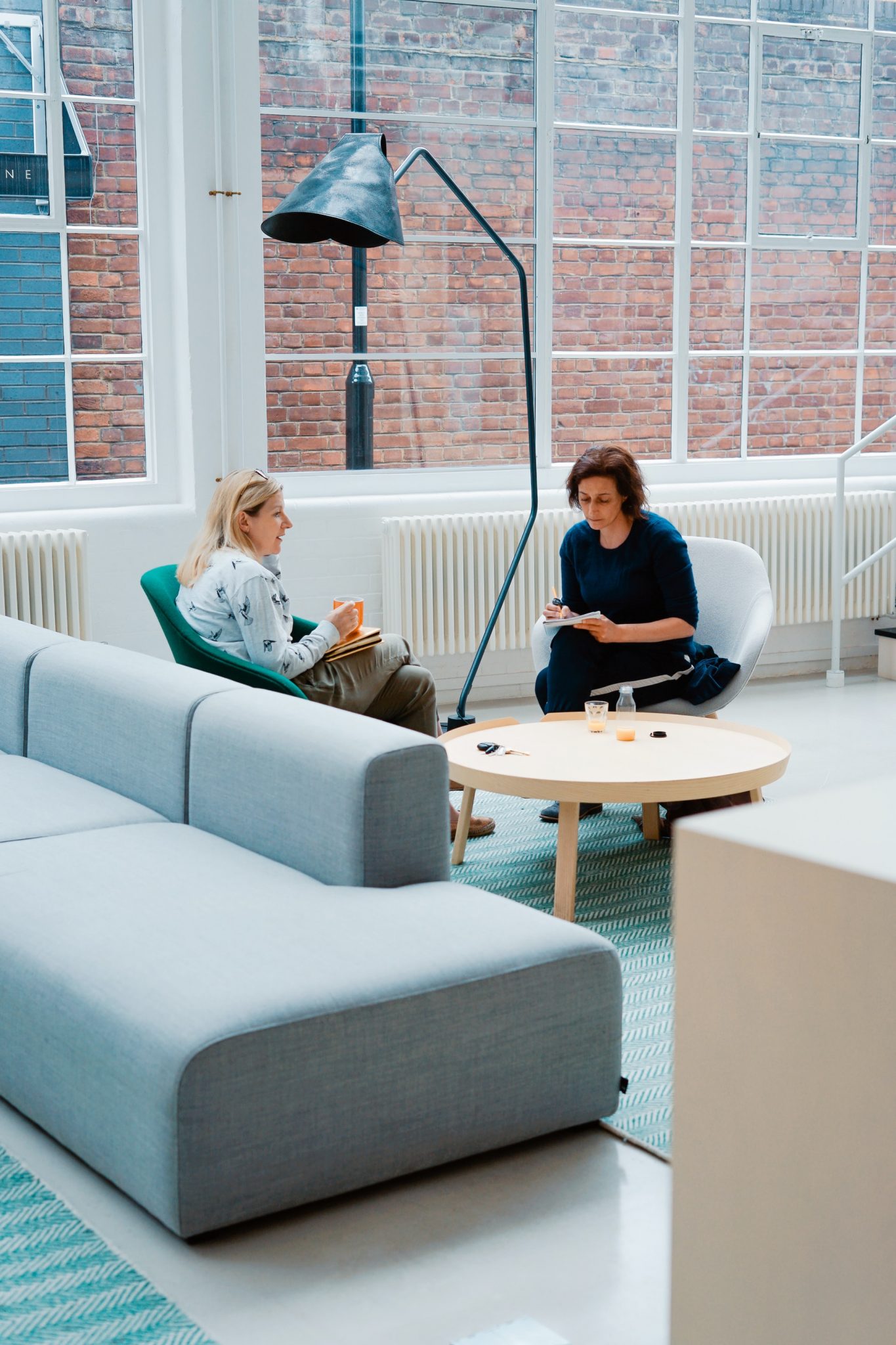 a couple of women sitting in chairs