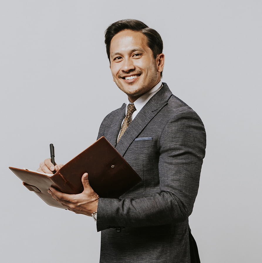 a person holding a pen and a clipboard