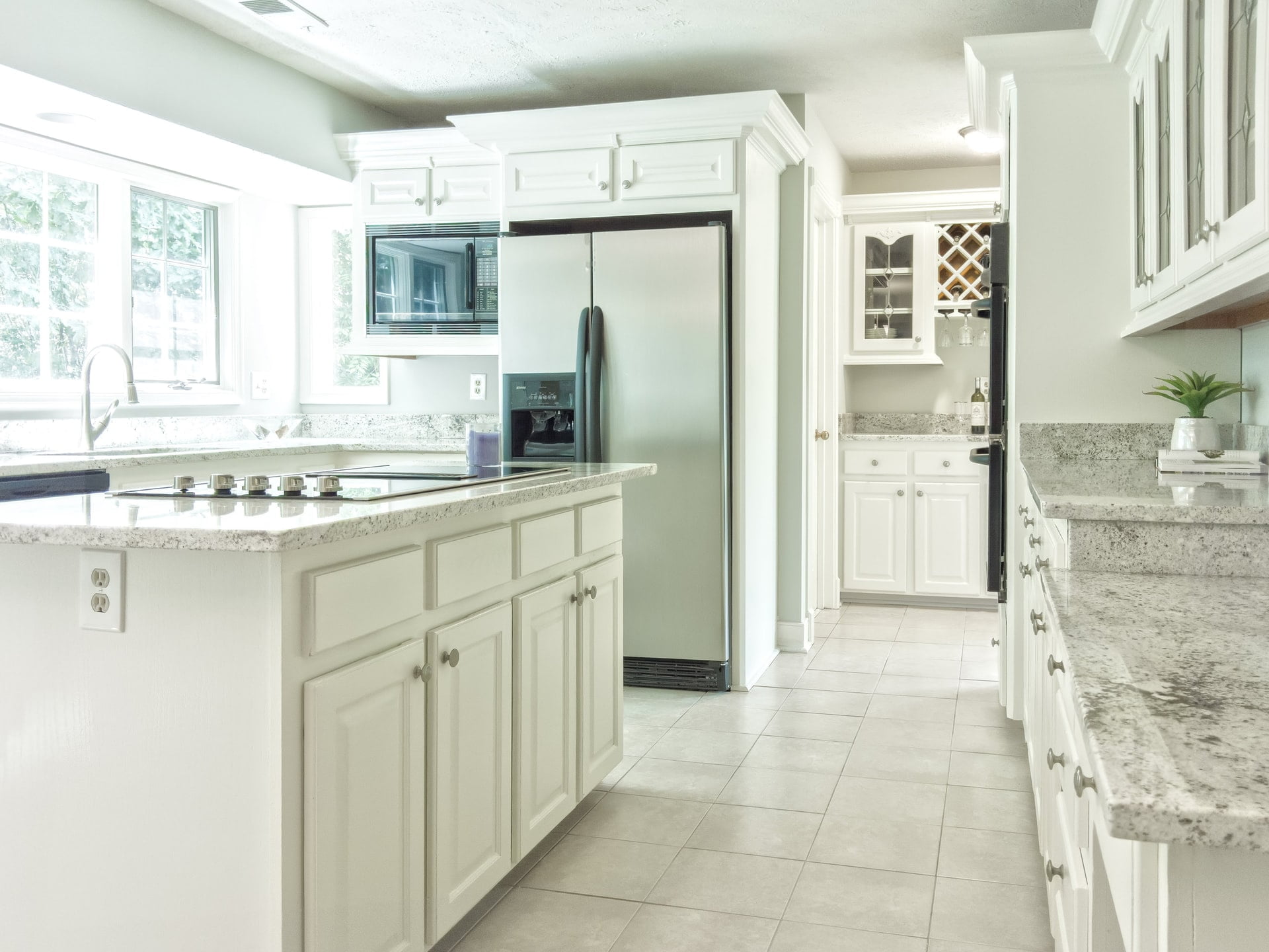 a kitchen with white cabinets