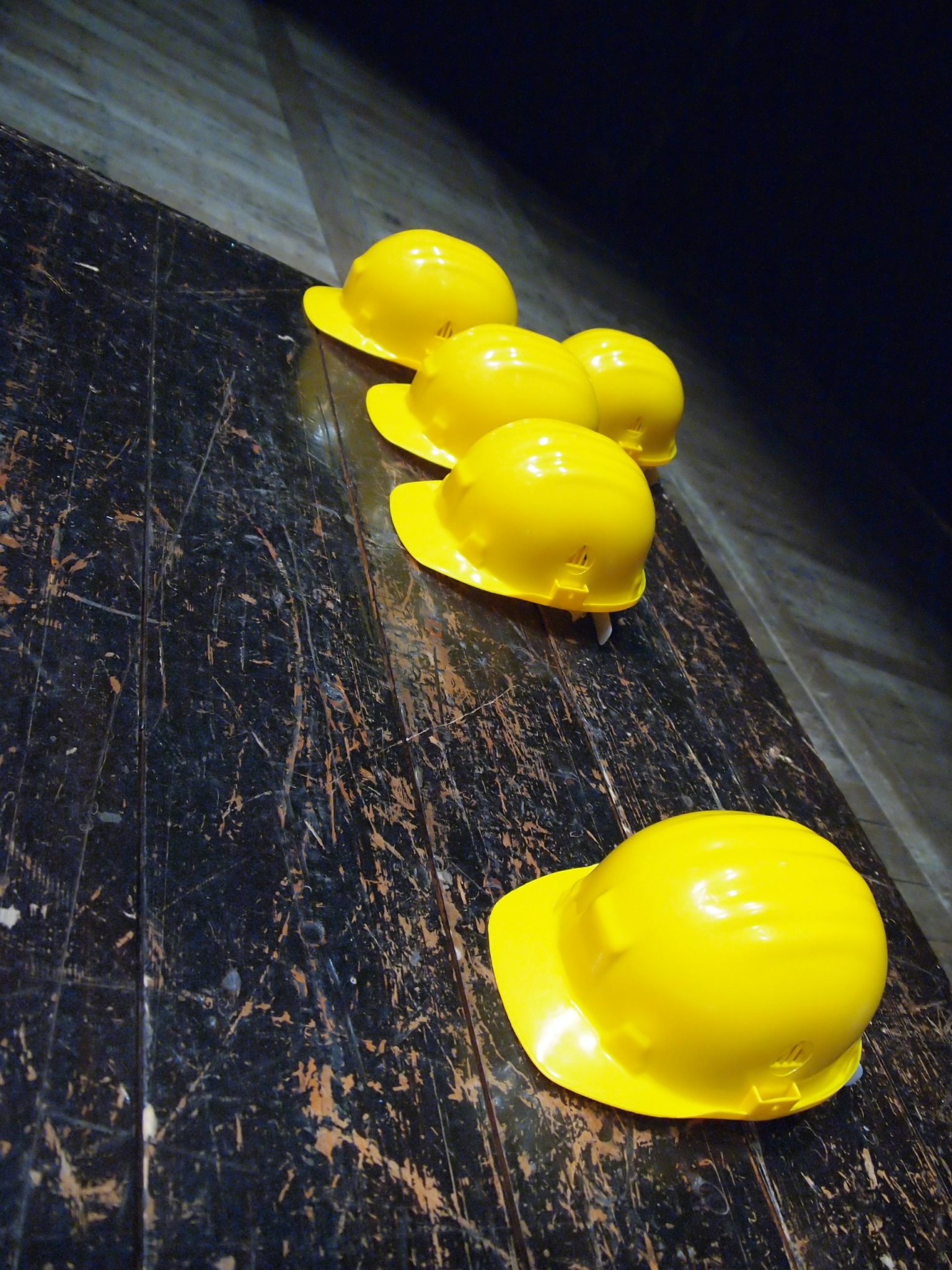 a group of yellow eggs on a black surface