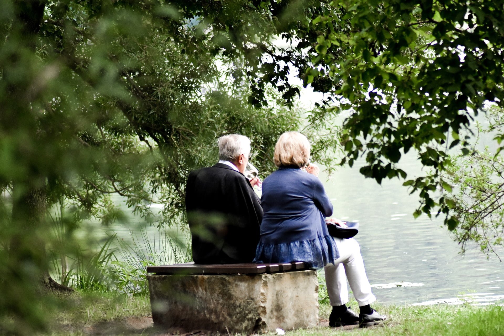 a group of women sitting on a bench