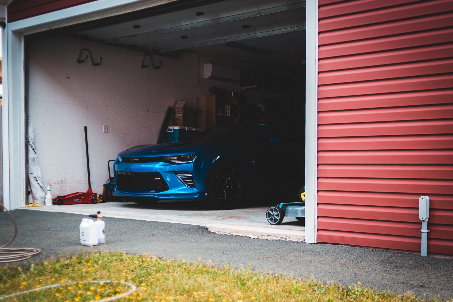 a garage door with a blue car