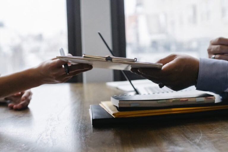 close-up of hands holding a pen
