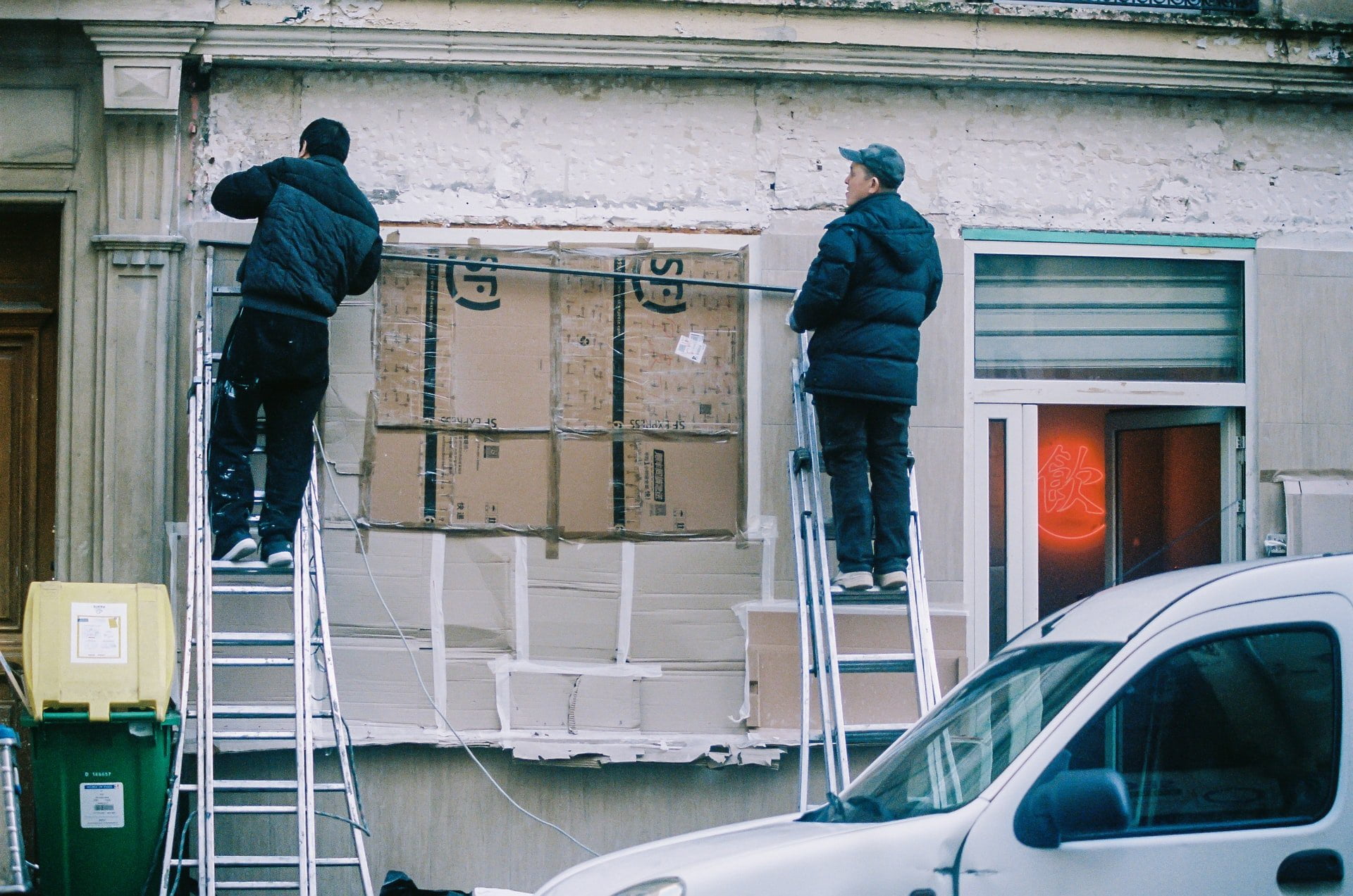 men standing on a ladder