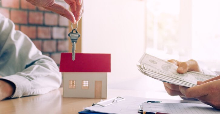 a person handing over a paper