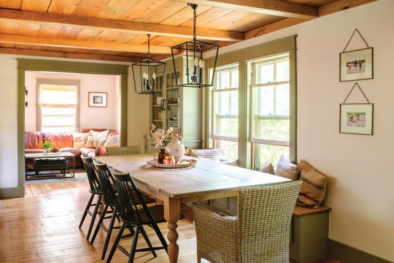 a dining room with a table and chairs