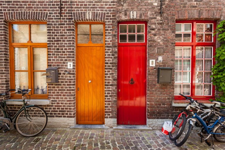 a door and window of a brick building