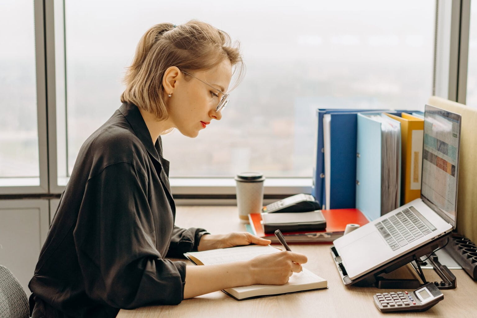 a woman working on her laptop