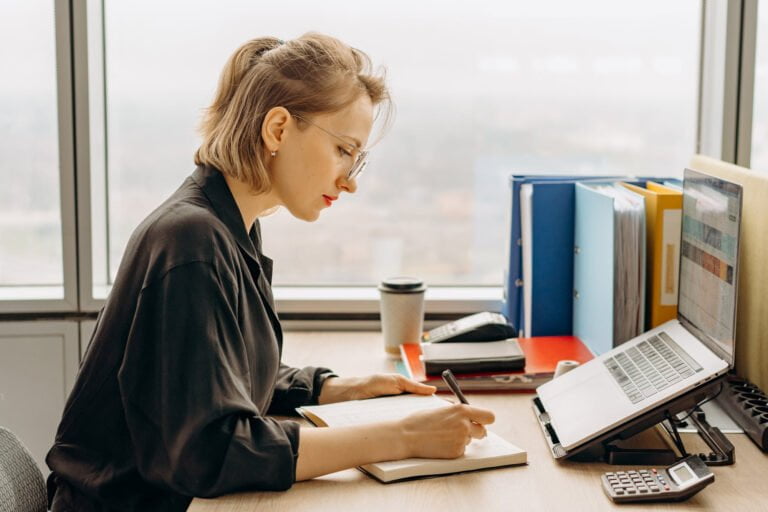 a woman working on her laptop