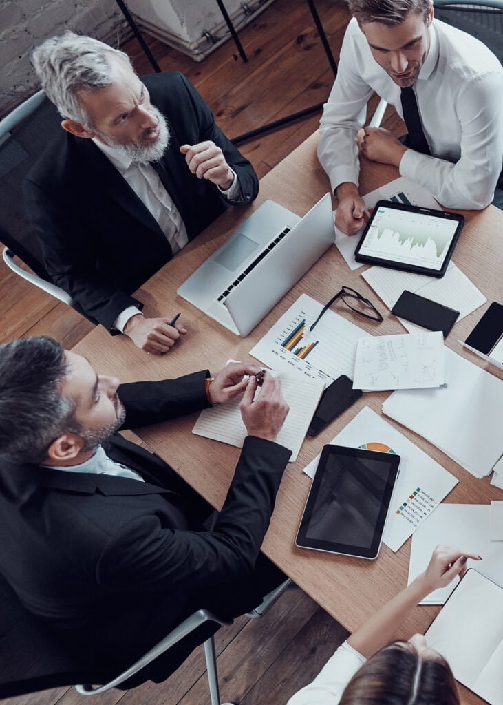 a group of people sitting around a table