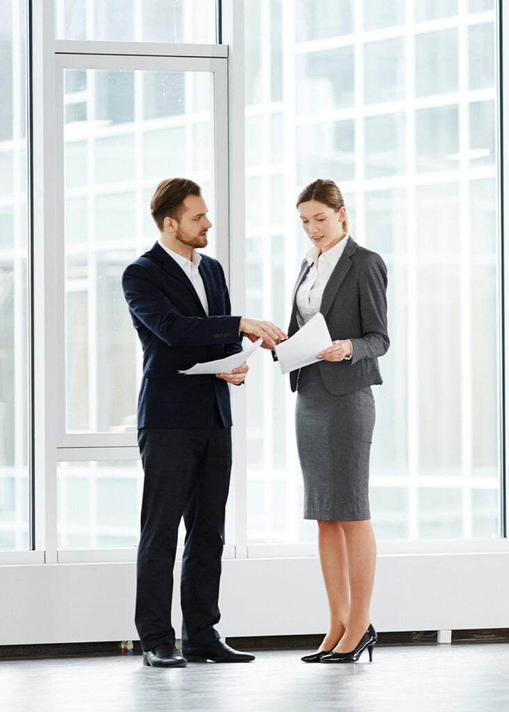 a man shaking hands with a woman