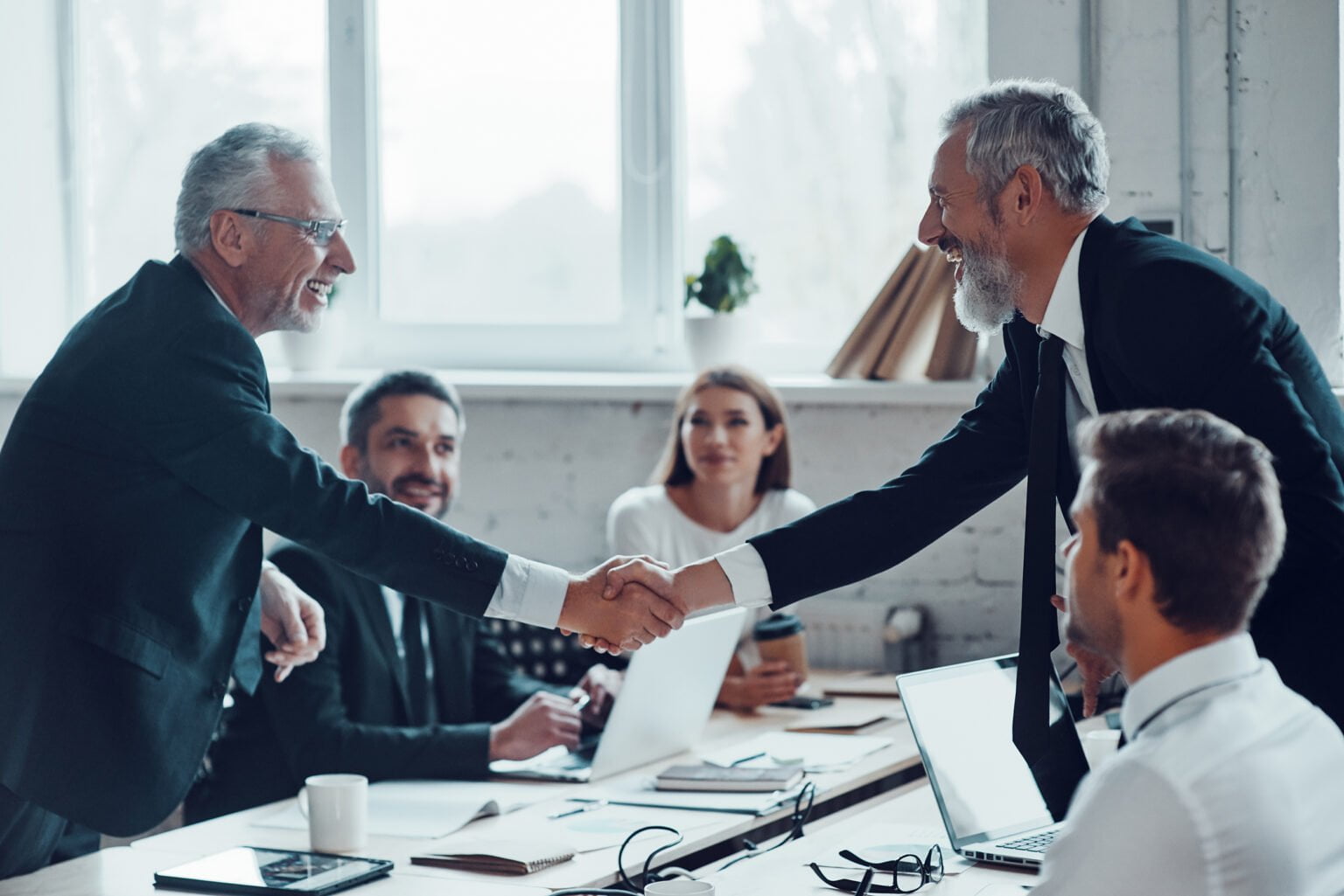 a group of people in a meeting