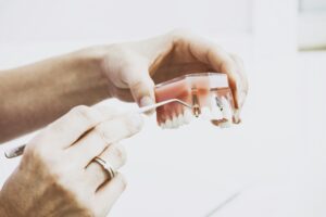 a person holding a plastic container