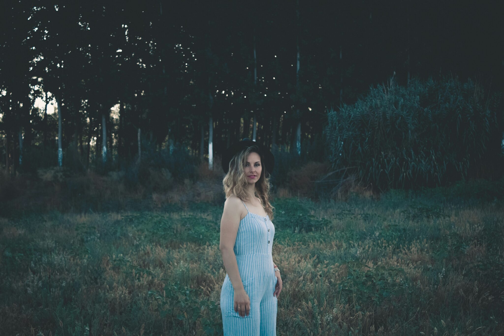 a person standing in a grassy area