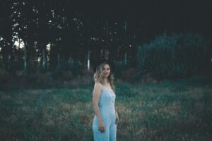a person standing in a grassy area